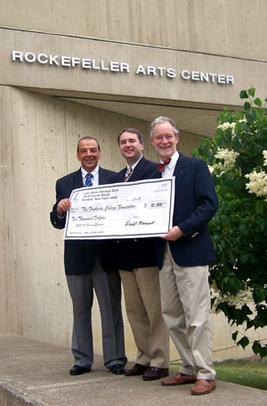 David C. Mancuso of Lake Shore Savings presents a check to Tim Murphy of the Fredonia College Foundation and Jefferson Westwood, Director of the Rockefeller Arts Center